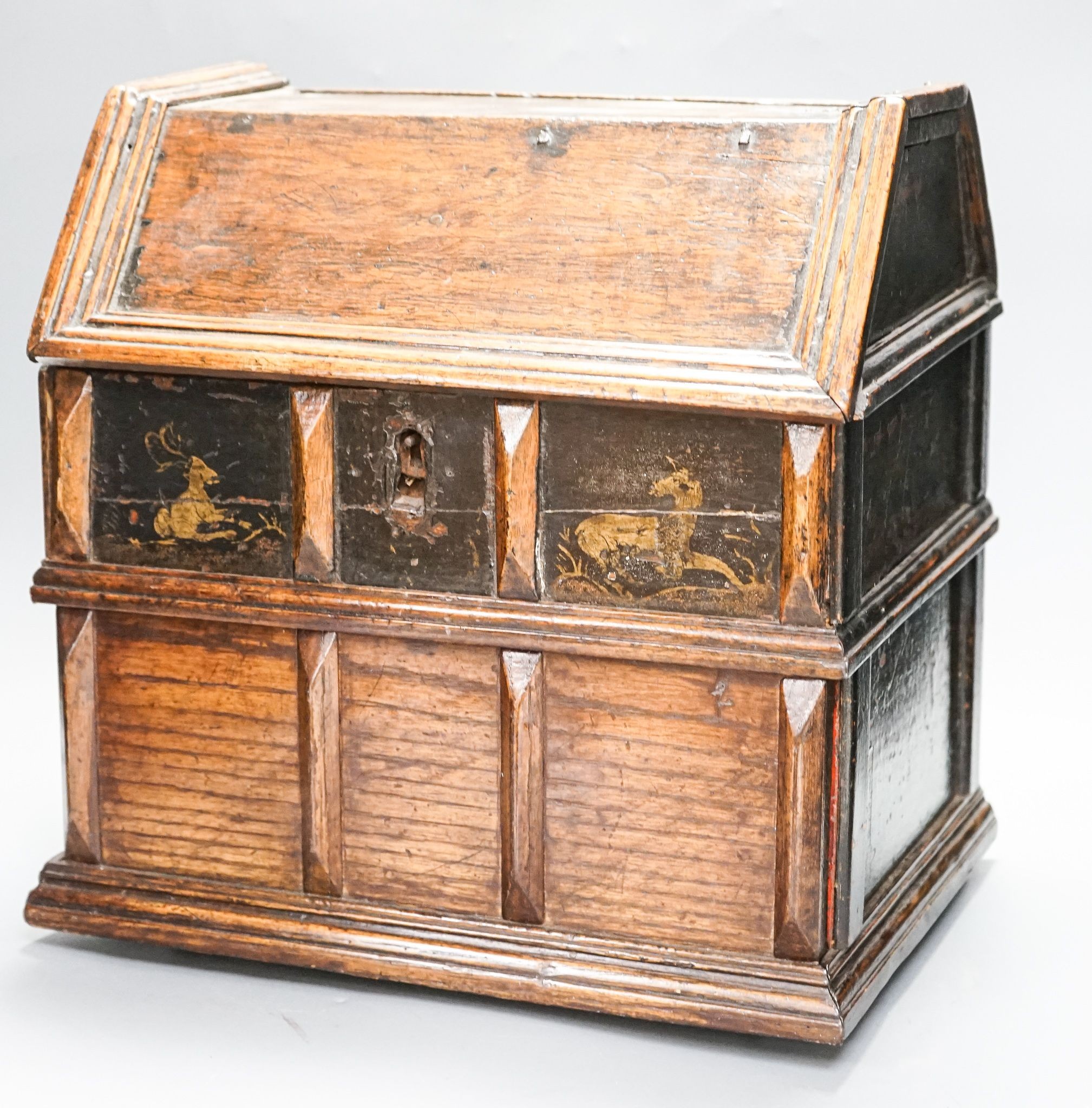 An unusual early 18th century Continental painted chestnut, oak and walnut table-top trunk with concealed drawers 38cm